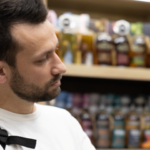 Man inspecting alcohol