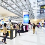 Busy airport terminal and shops
