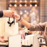 Smart lady making a duty free shopping purchase