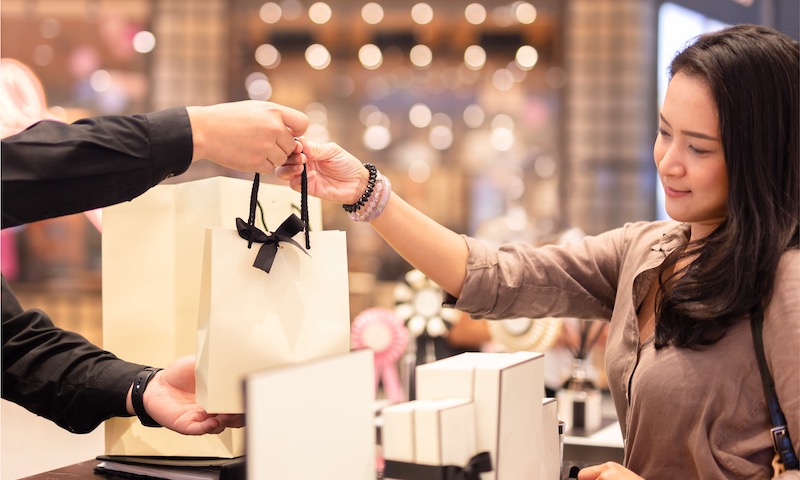 Why do shoppers interact with staff during their time in the Duty Free store?